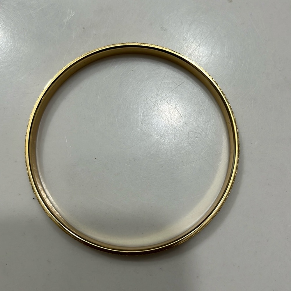 MONET vintage gold tone bangle bracelet. Solid. Exc condition. Beautiful sparkle